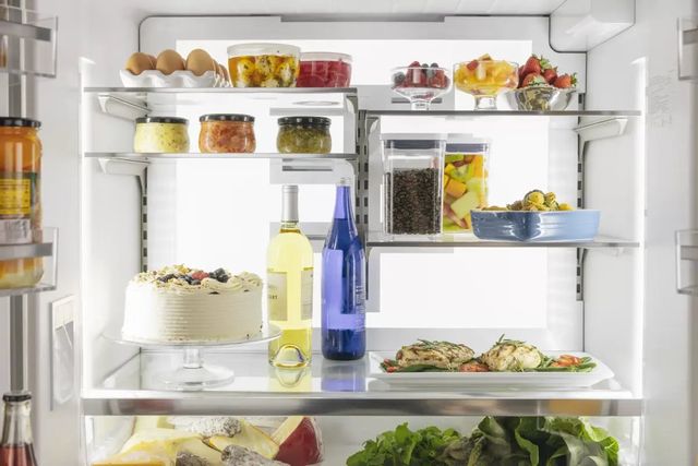 front view of the inside of a fully stocked and organized refrigerator