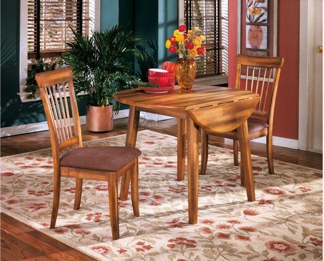 Ashley Furniture dining table with drop leaf design