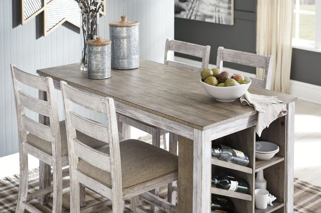 standing view of a two-tone wood counter height storage dining table with accents on top and in the storage compartments
