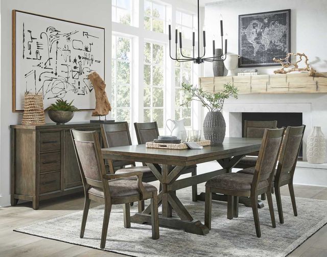 front view of a modern white dining room with a dark brown rectangular wood table, matching chairs, and a matching accents throughout