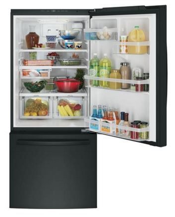 Black GE bottom freezer refrigerator with door ajar