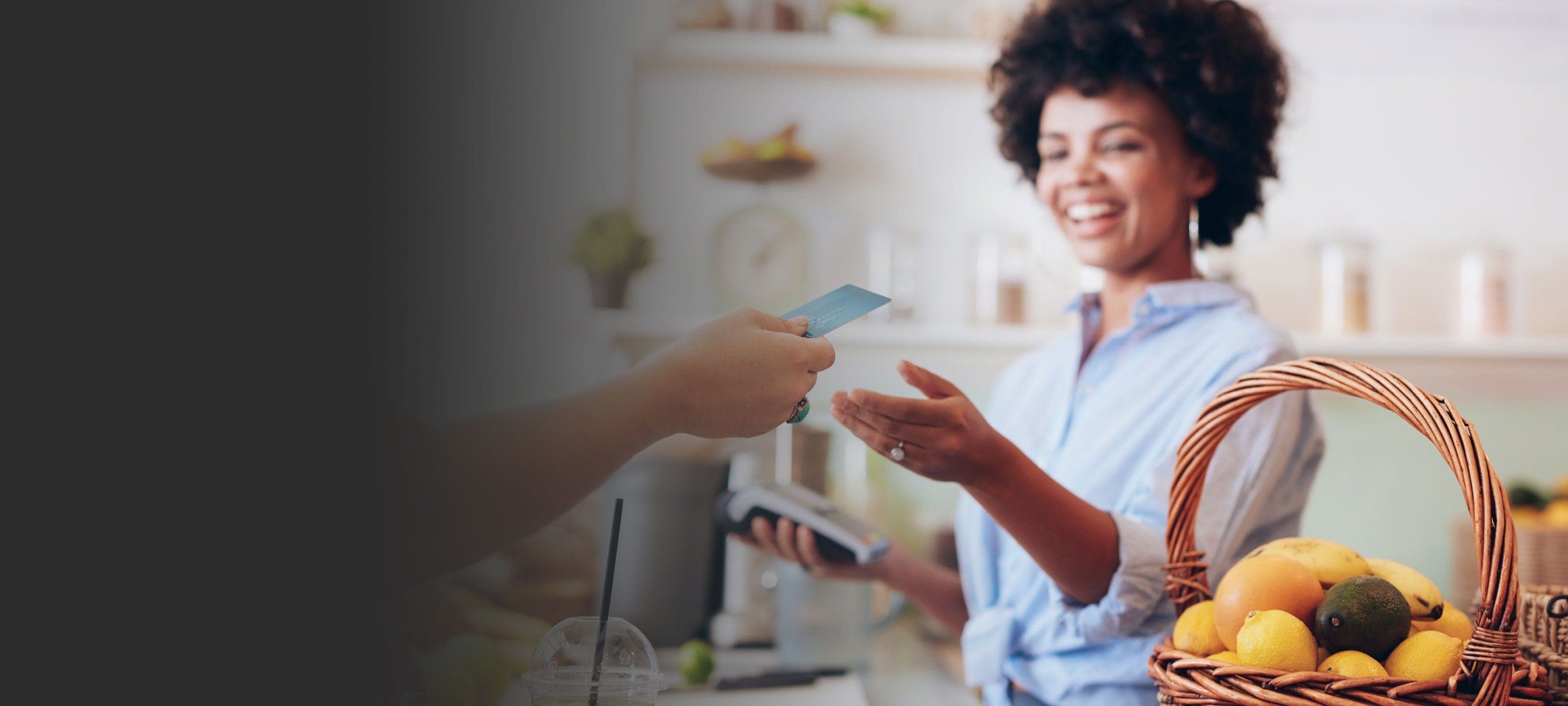 person paying for product with store clerk