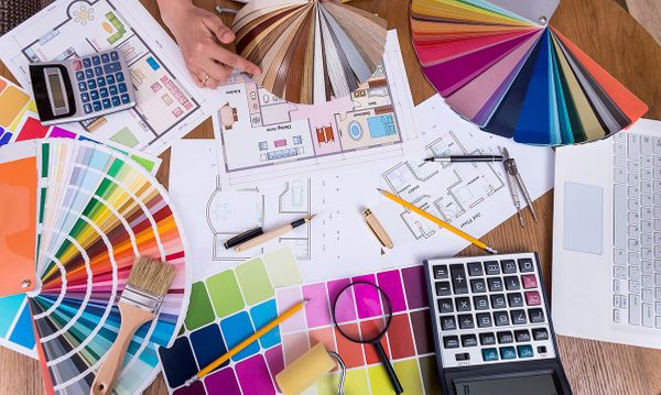 designers looking at layouts and color swatches